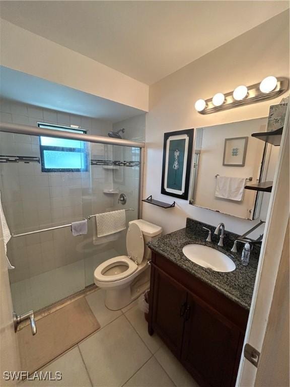 4301 Island Cir Unit 2, Fort Myers, FL 33919 - bathroom featuring tile patterned floors, vanity, a shower stall, and toilet