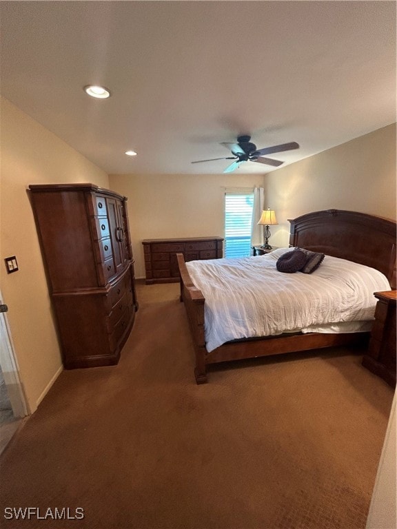 bedroom featuring dark colored carpet and ceiling fan