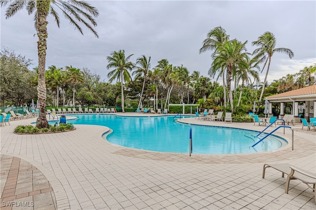 view of swimming pool with a patio