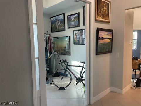 hallway featuring light tile patterned floors