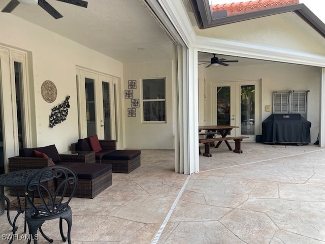 view of patio / terrace with outdoor lounge area, french doors, area for grilling, and ceiling fan