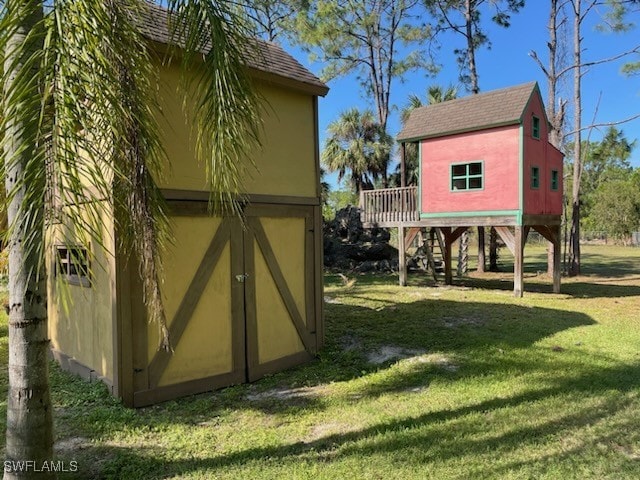 view of outdoor structure with a lawn