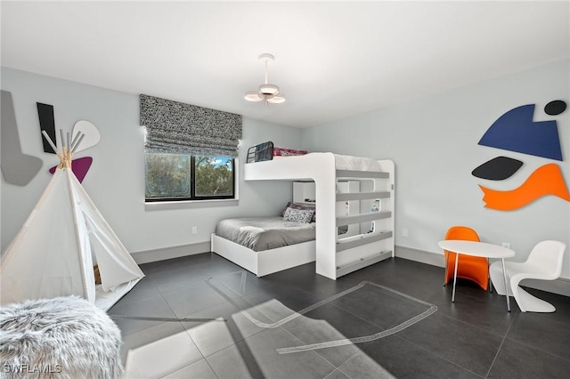 bedroom featuring dark tile patterned flooring