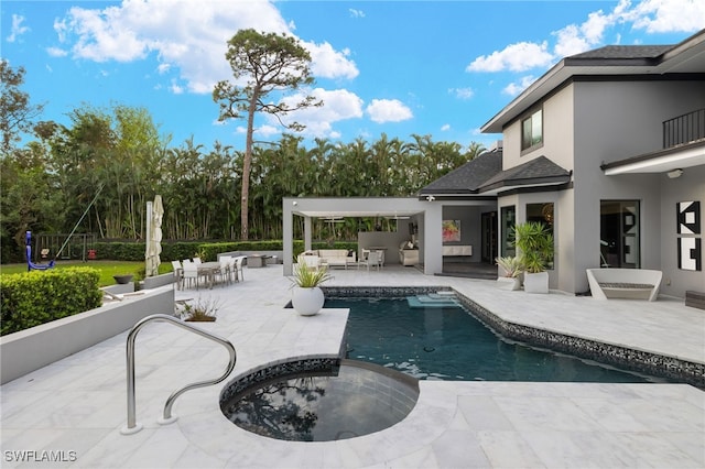 view of swimming pool with a patio area, an outdoor living space, and an in ground hot tub