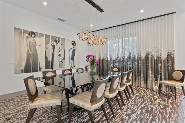 dining space featuring an inviting chandelier