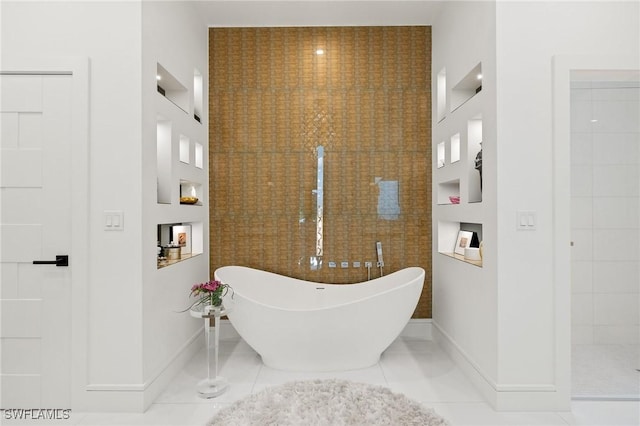 bathroom featuring tile patterned flooring and shower with separate bathtub