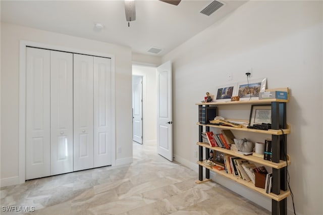 bedroom with ceiling fan and a closet