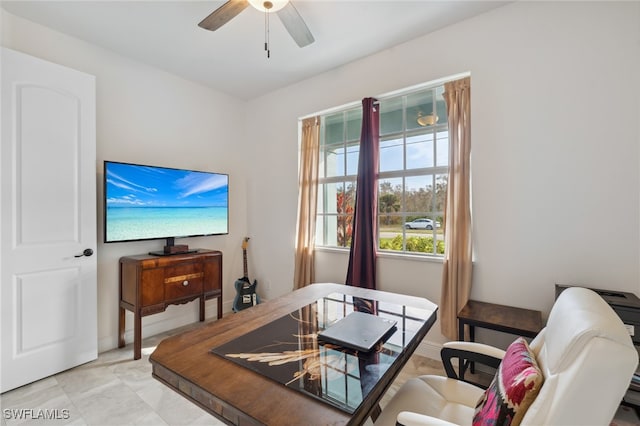 interior space featuring ceiling fan and light tile patterned floors