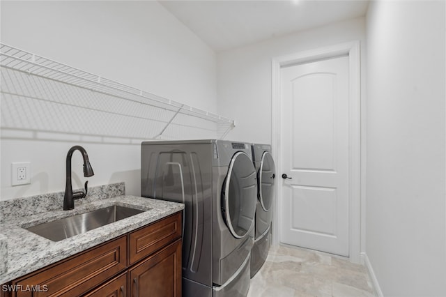 laundry room featuring separate washer and dryer and sink