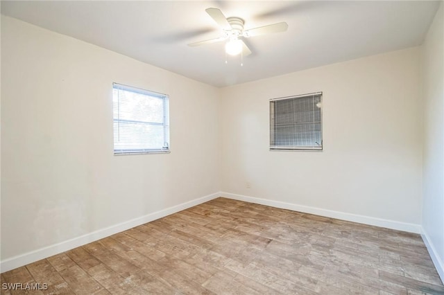 unfurnished room featuring ceiling fan and light wood-type flooring