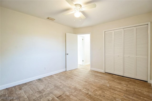 unfurnished bedroom with a closet, ceiling fan, and light hardwood / wood-style floors