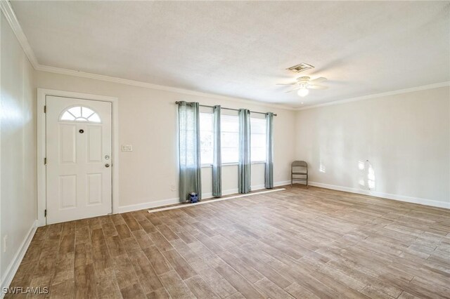 foyer entrance featuring ceiling fan, light hardwood / wood-style floors, and ornamental molding