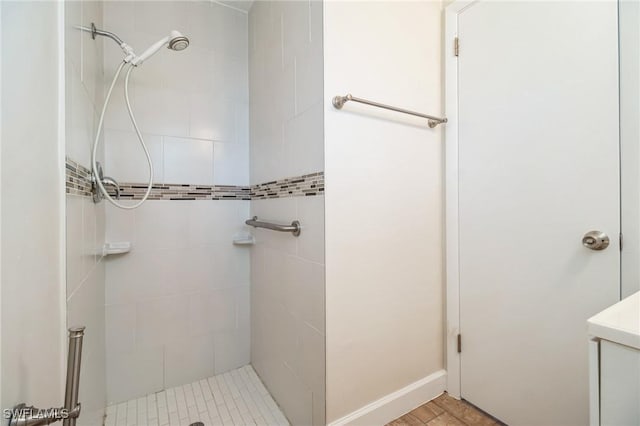 bathroom with tiled shower