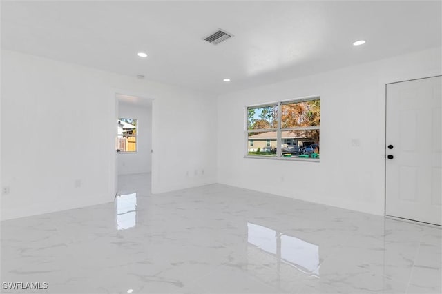 18289 Eblis Ave, Port Charlotte, FL 33948 - spare room with recessed lighting, baseboards, and visible vents
