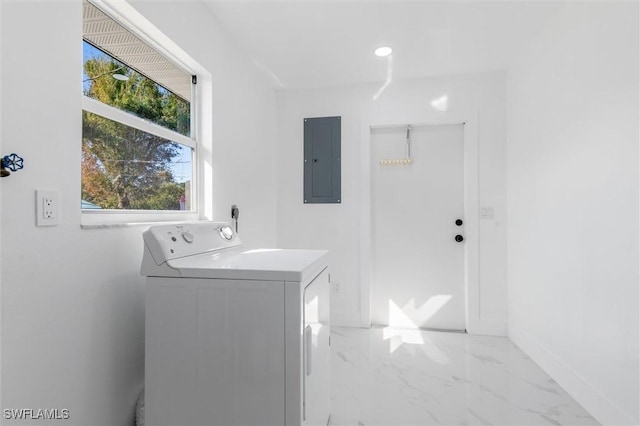 18289 Eblis Ave, Port Charlotte, FL 33948 - washroom featuring plenty of natural light, electric panel, laundry area, washer / clothes dryer, and marble finish floor
