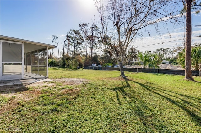 view of yard featuring a sunroom