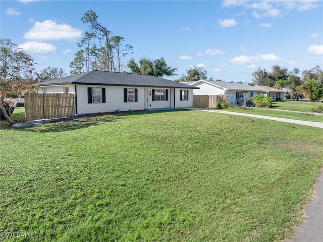 ranch-style house featuring a front lawn