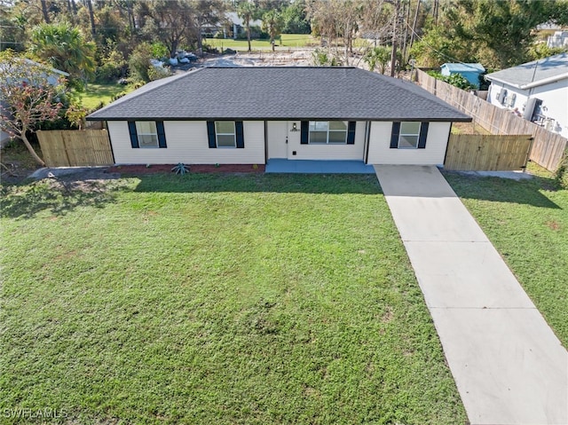 ranch-style house with a front lawn