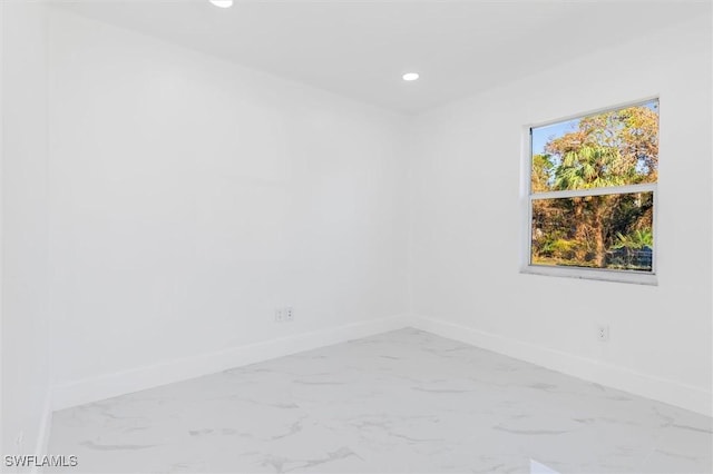 18289 Eblis Ave, Port Charlotte, FL 33948 - unfurnished room featuring baseboards, recessed lighting, and marble finish floor