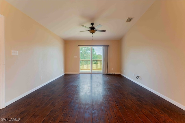 unfurnished room featuring dark wood-type flooring and ceiling fan