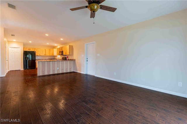 unfurnished living room with dark wood-type flooring and ceiling fan