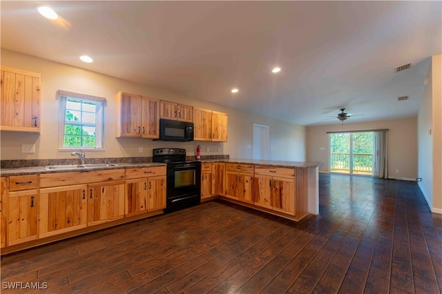 kitchen featuring black appliances, sink, kitchen peninsula, ceiling fan, and dark hardwood / wood-style floors