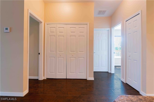 hallway featuring dark hardwood / wood-style floors