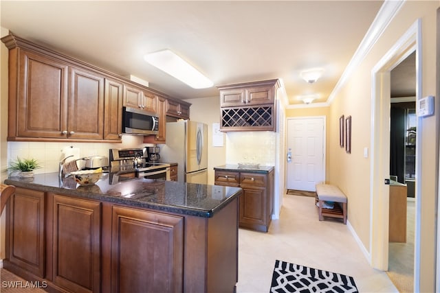 kitchen with stainless steel appliances, kitchen peninsula, light tile patterned floors, crown molding, and decorative backsplash