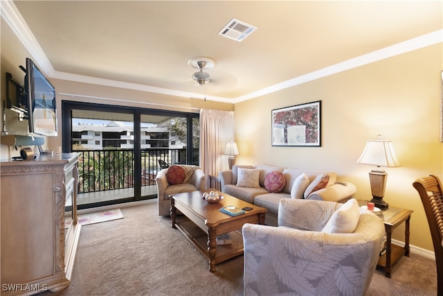 living room with ornamental molding, light carpet, and ceiling fan