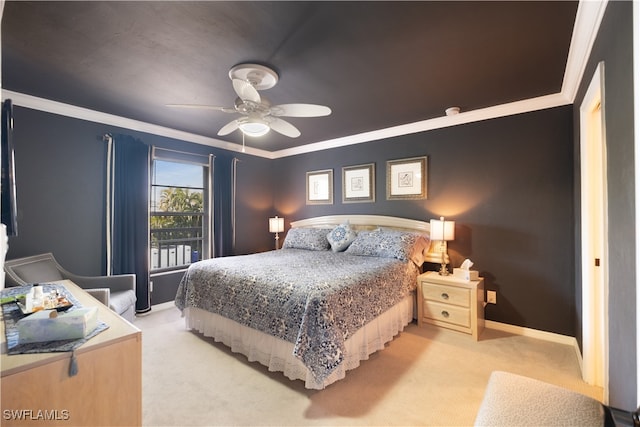 carpeted bedroom with ornamental molding and ceiling fan