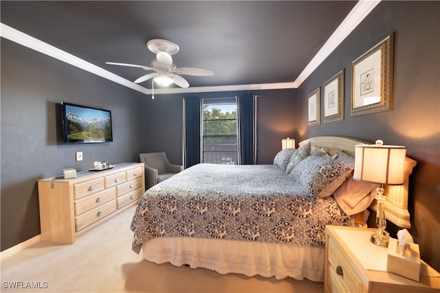 carpeted bedroom featuring ceiling fan and ornamental molding