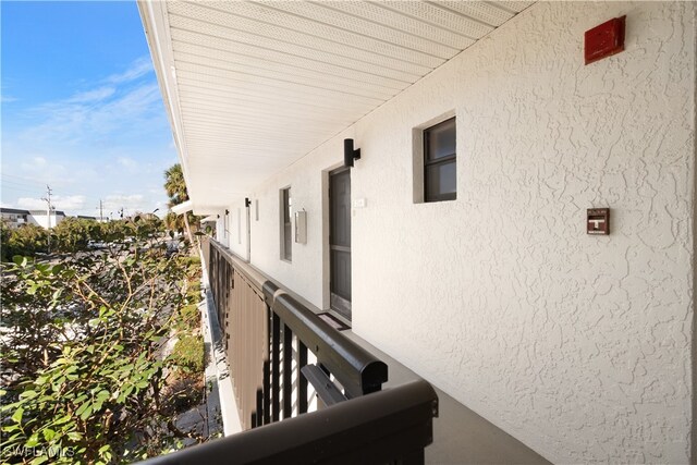 view of side of property featuring a balcony