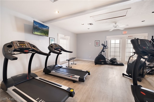 workout area featuring ceiling fan and light hardwood / wood-style flooring