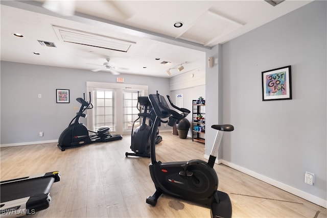 exercise area with hardwood / wood-style flooring and ceiling fan