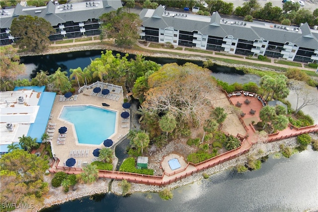 birds eye view of property with a water view