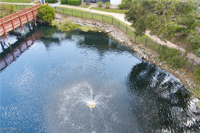 view of pool featuring a water view