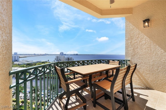 balcony featuring a water view