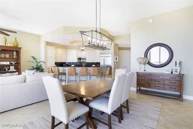 tiled dining room with ceiling fan