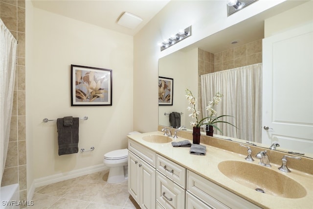 bathroom featuring toilet, vanity, tile patterned floors, and a shower with shower curtain