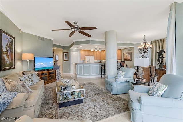 tiled living room with ceiling fan with notable chandelier and ornamental molding