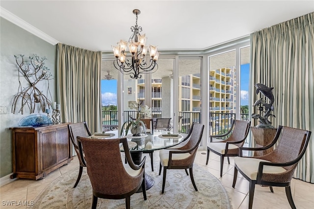 tiled dining area featuring plenty of natural light, ornamental molding, and an inviting chandelier