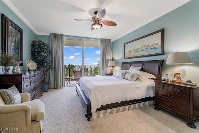 carpeted bedroom featuring ceiling fan, expansive windows, access to exterior, and crown molding