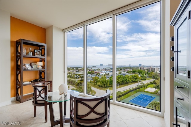 interior space featuring floor to ceiling windows and light tile patterned floors