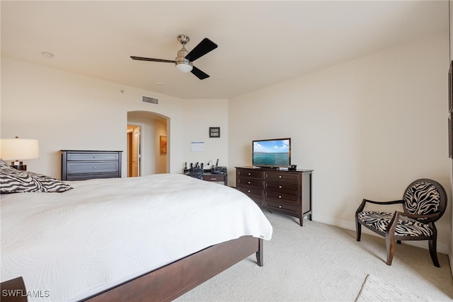 bedroom with light colored carpet and ceiling fan