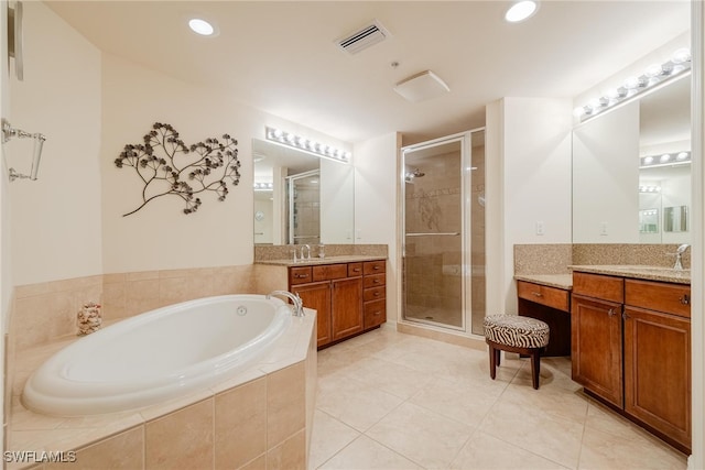 bathroom featuring separate shower and tub, tile patterned flooring, and vanity