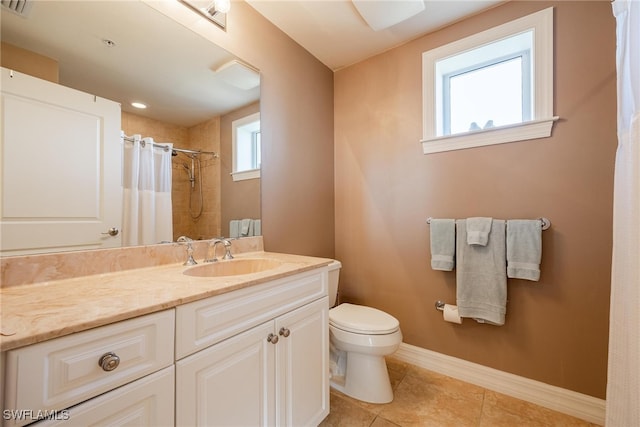 bathroom featuring toilet, vanity, tile patterned floors, and curtained shower