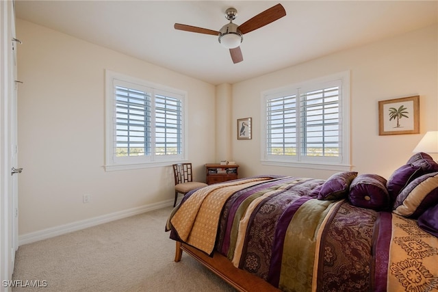 bedroom featuring light colored carpet and ceiling fan