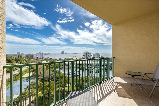 balcony featuring a water view