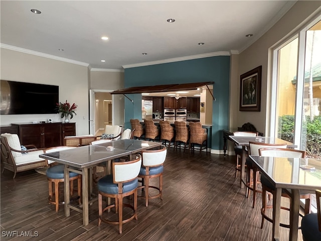 dining area featuring ornamental molding and dark wood-type flooring