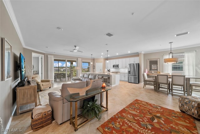 tiled living room featuring crown molding and ceiling fan